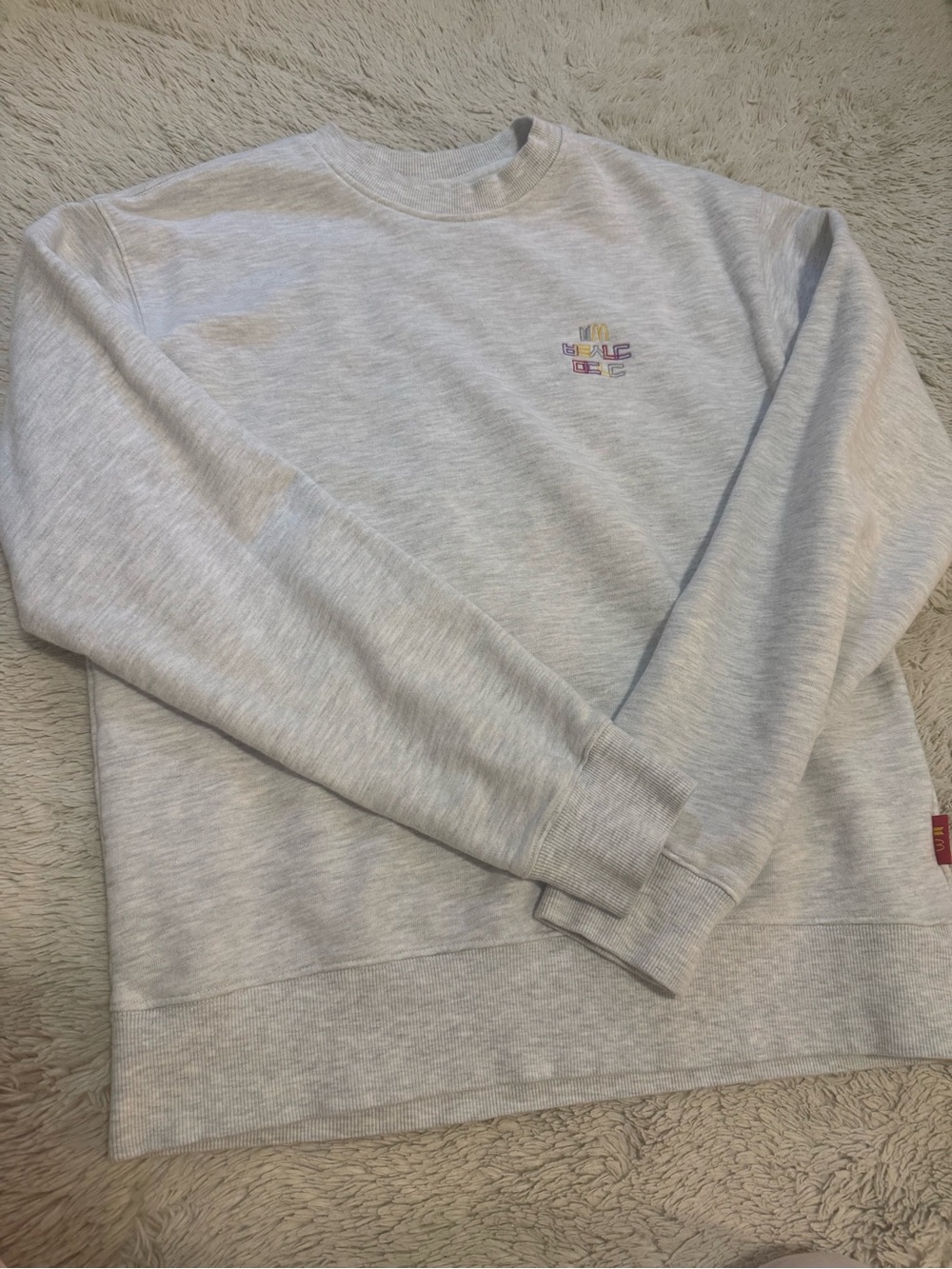 Light Gray Crewneck Sweatshirt with Small Multicolor Chest Emblem